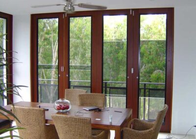 Sashless windows in timber Bi-fold door