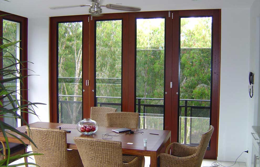 Sashless windows in timber Bi-fold door